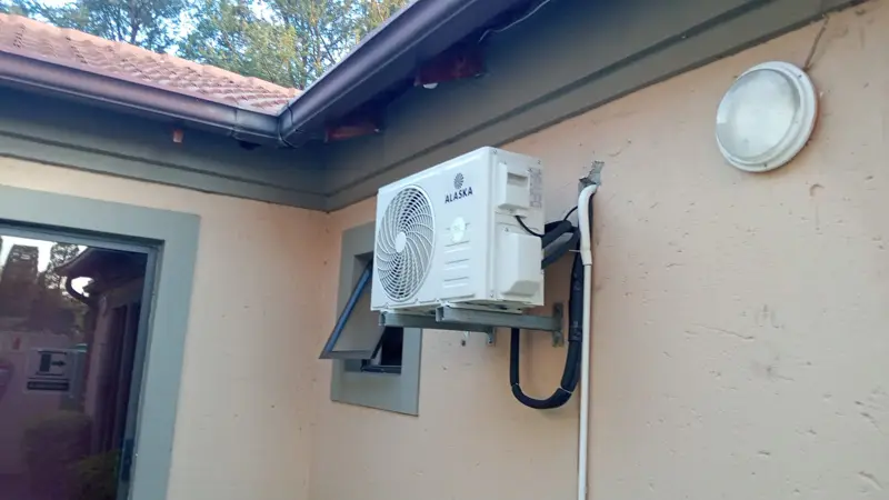 Alaska aircon outdoor unit installed on a wall bracket